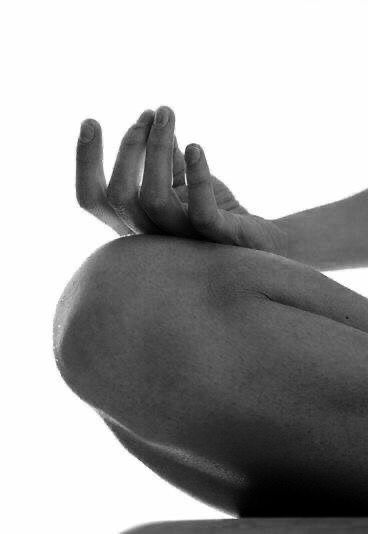 Black-and-white detail of a meditation pose